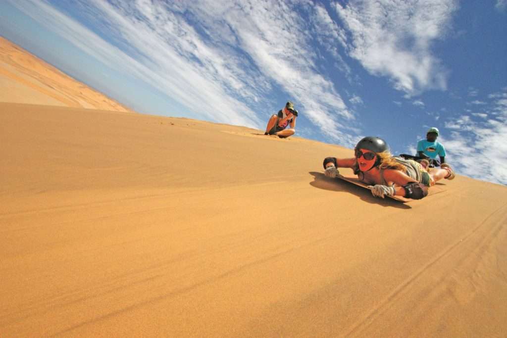 Sandboard and Sunrise Dunes in Sossusvlei, Namibia